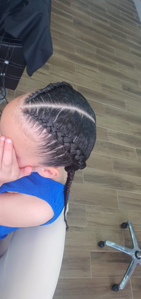 Kids cornrows side part with single braid by Lorellin Hair & Beauty in Wolverhampton