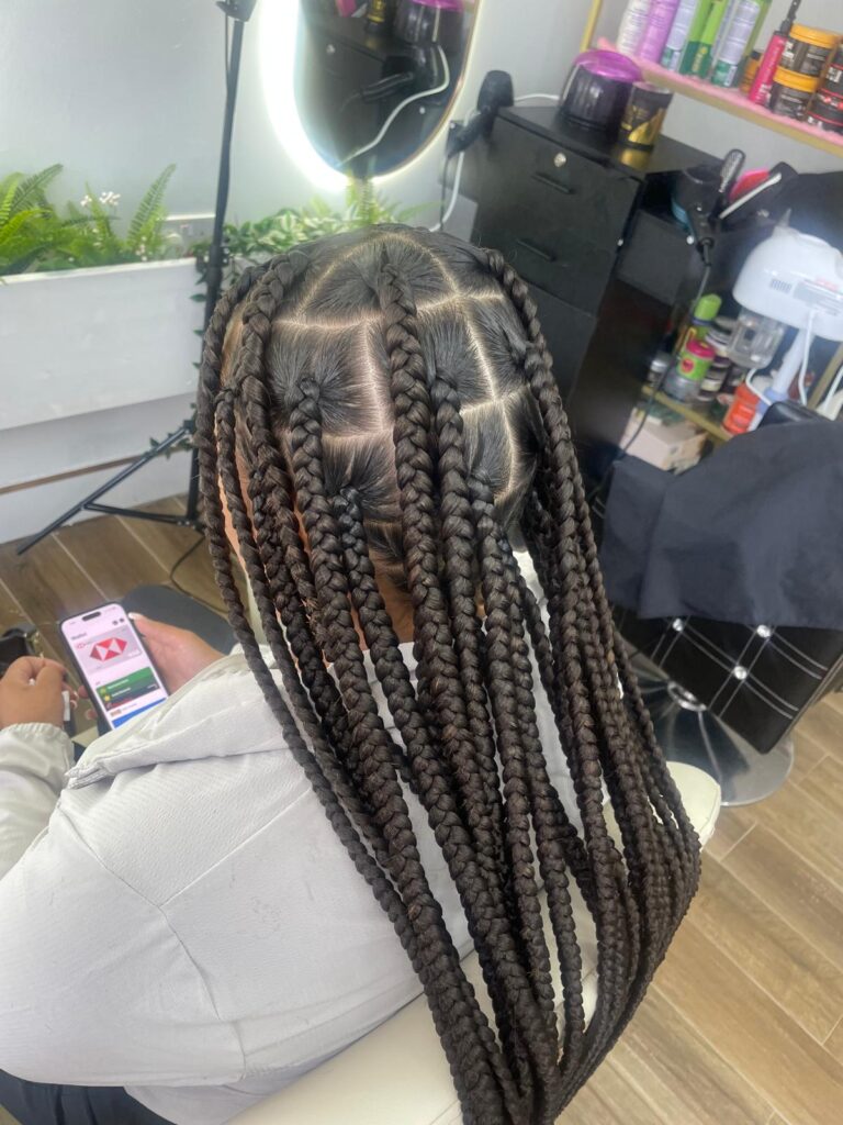 Long box braids with neat parting by Lorellin Hair & Beauty in Wolverhampton