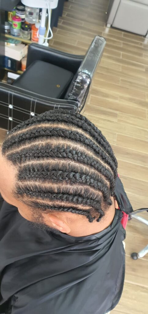 Mens straight back cornrows with clean parting by Lorellin Hair & Beauty in Wolverhampton