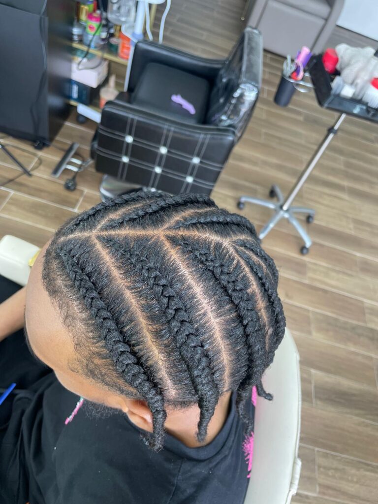 Straight back cornrows with clean parting by Lorellin Hair & Beauty in Wolverhampton