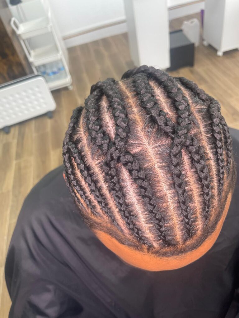 Neat straight back cornrows with even parting by Lorellin Hair & Beauty in Wolverhampton
