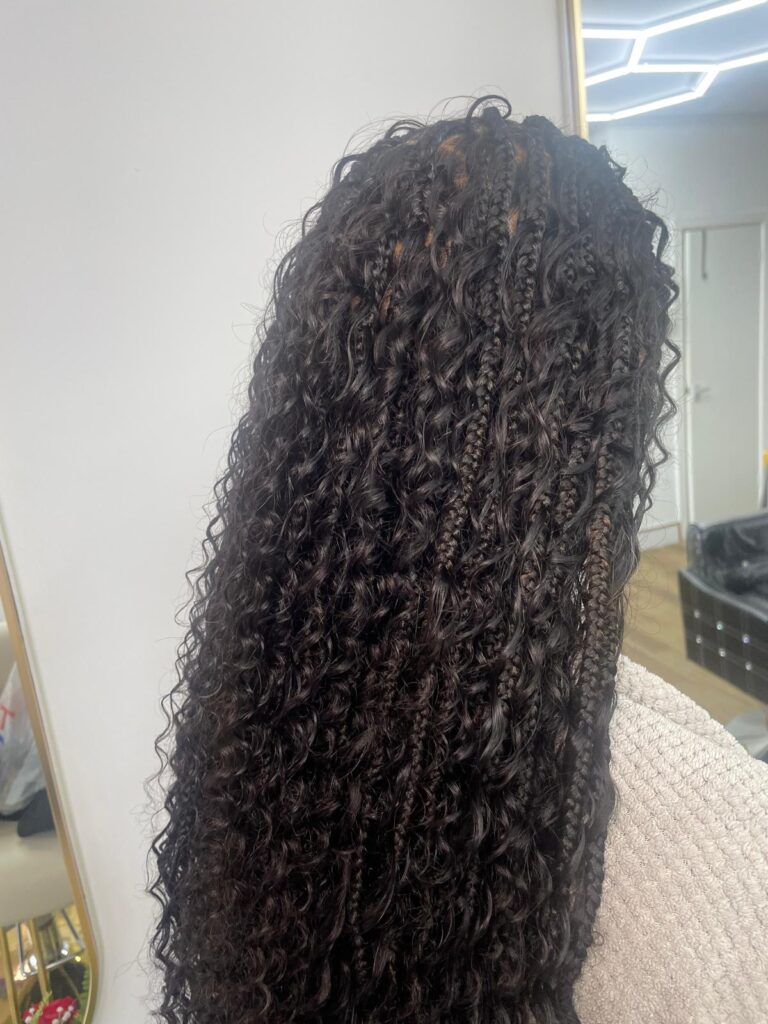 Long boho braids with curly ends in natural black colour by Lorellin Hair & Beauty in Wolverhampton