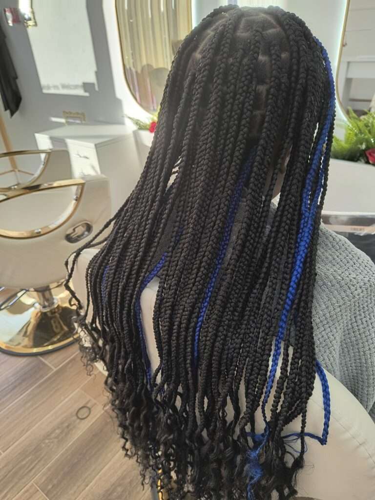 Long black box braids with blue highlights, styled at Lorellin Hair & Beauty Salon in Coseley Bilston.