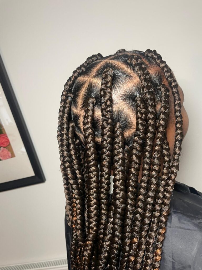 Large box braids with neat grid parting by Lorellin Hair & Beauty in Wolverhampton