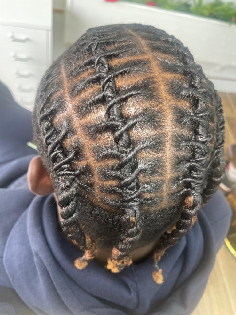 Creative stitch cornrows with cross pattern design by Lorellin Hair & Beauty in Wolverhampton