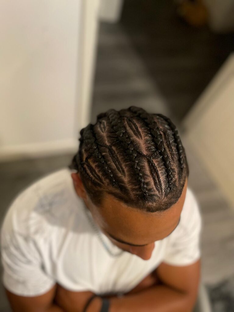 Mens cornrows straight back with clean parting by Lorellin Hair & Beauty in Wolverhampton