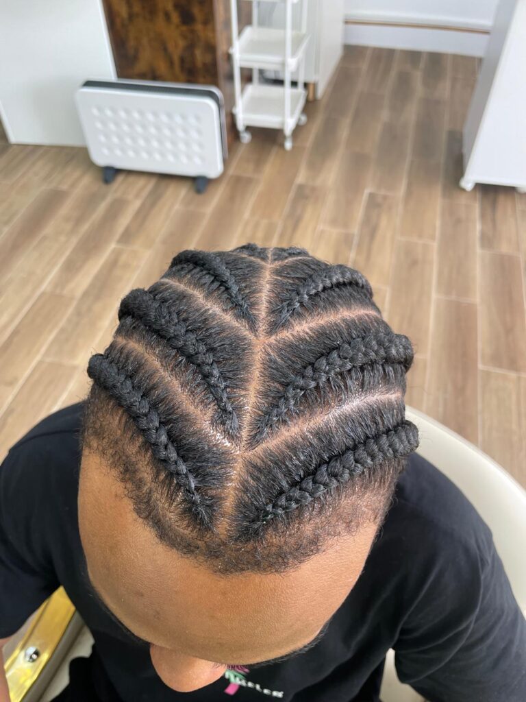 V shape cornrows with clean parting by Lorellin Hair & Beauty in Wolverhampton