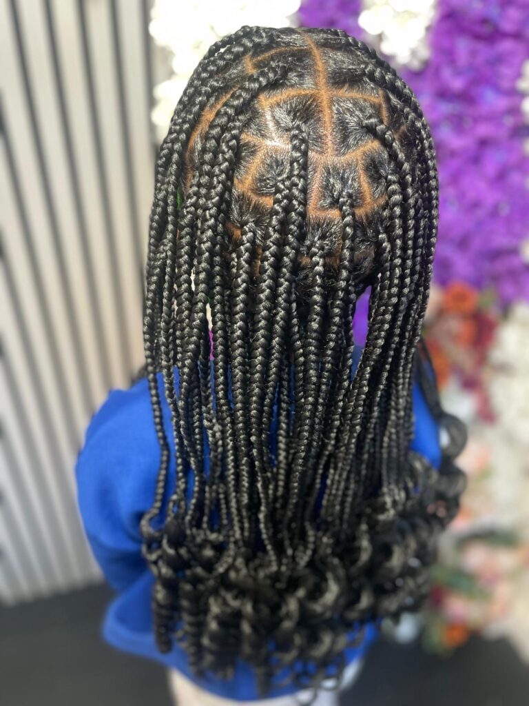 Kids braids with curls and patterned parting by Lorellin Hair & Beauty in Wolverhampton