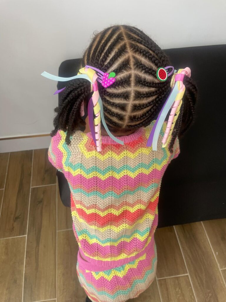 Kids cornrows with zig zag pattern and colourful ribbons by Lorellin Hair & Beauty in Wolverhampton