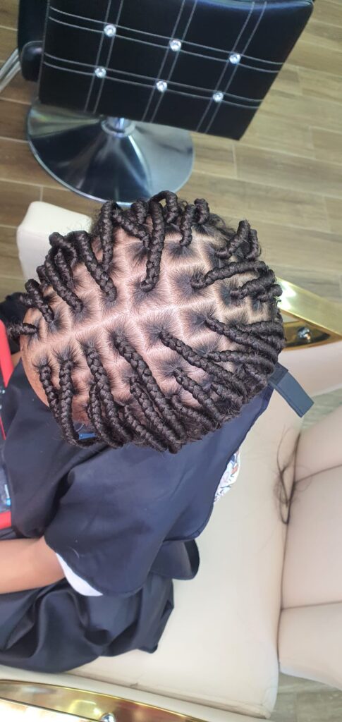 Chunky two strand twists with star parting pattern by Lorellin Hair & Beauty in Wolverhampton